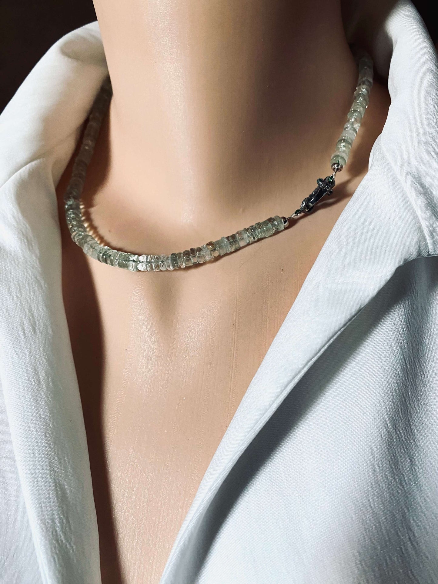 Green amethyst beaded necklace with diamond & emerald pavé clasp displayed on a mannequin.