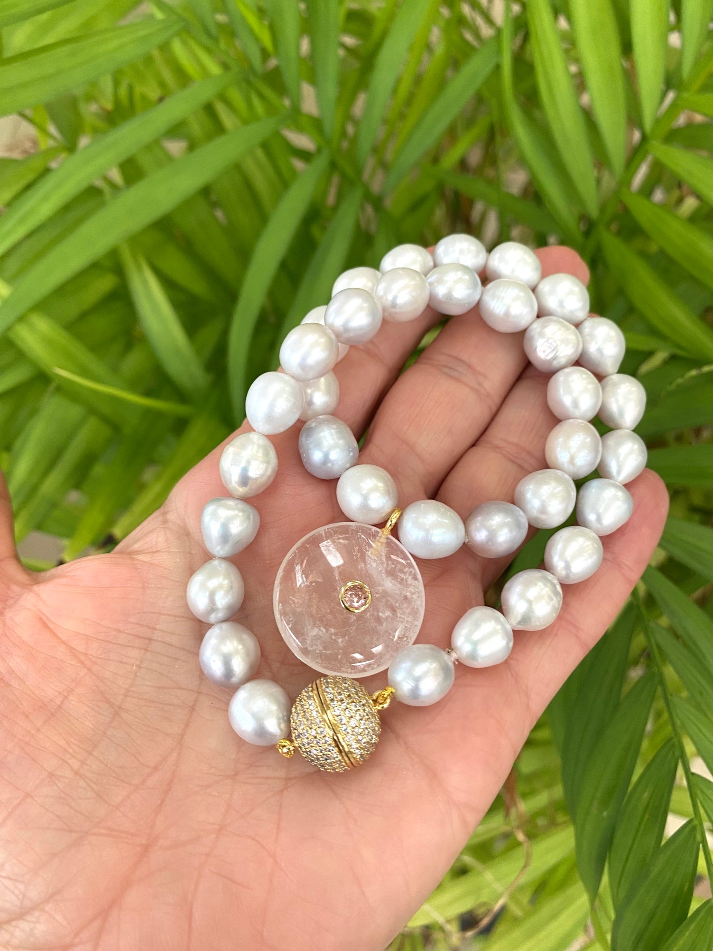 Grey pearl necklace with coin pendant and magnetic clasp close up