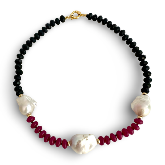 hot-pink jade and deep black tourmaline beads, each one carefully selected for its natural brilliance and texture. The gemstones are hand-knotted on durable black silk thread and finished with a vermeil gold-plated marine clasp