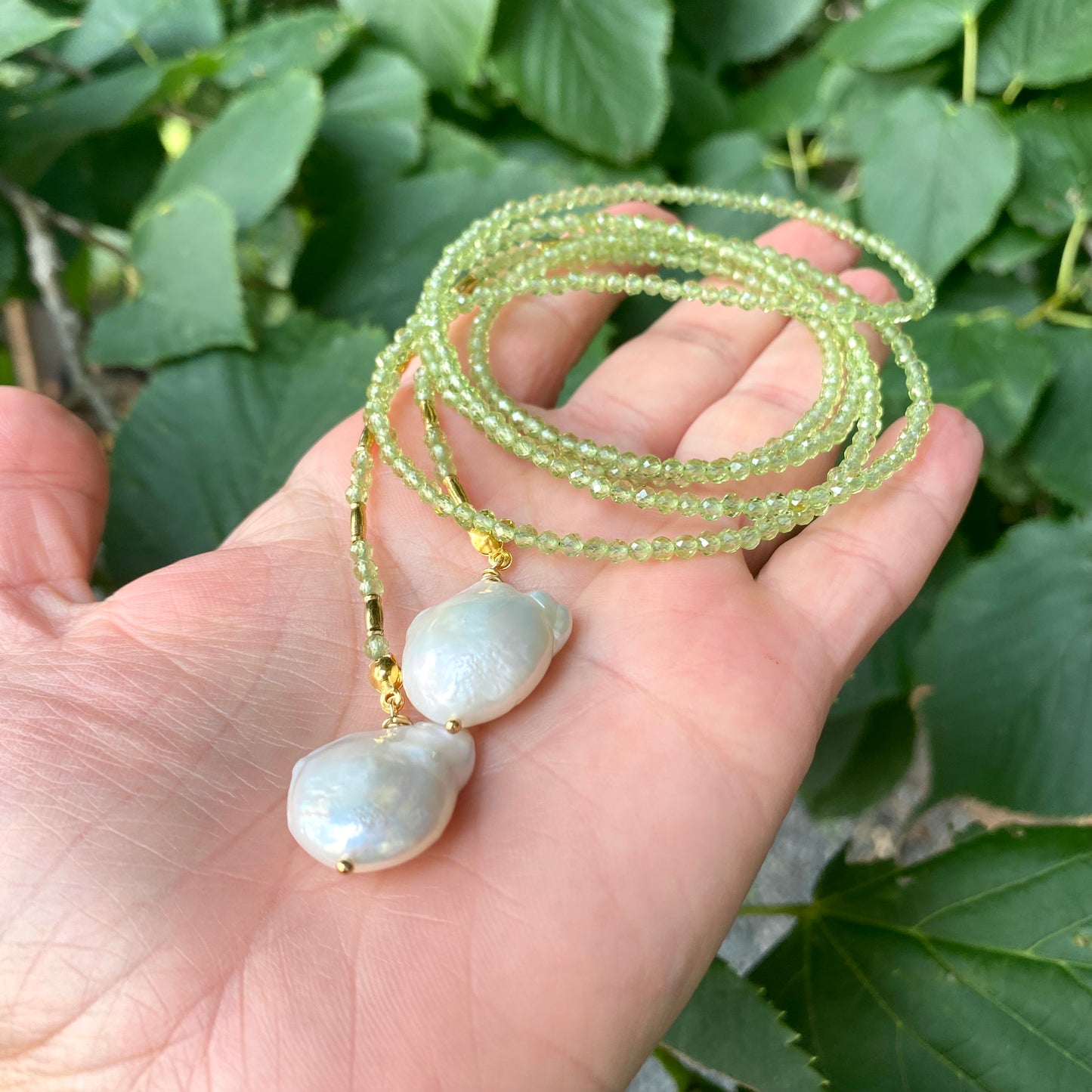 Peridot baroque pearl lariat necklace close-up showing organic baroque pearl shapes and green beads