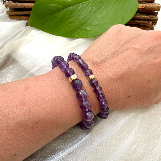 Amethyst Bracelet pair worn on woman’s wrist – natural lifestyle shot