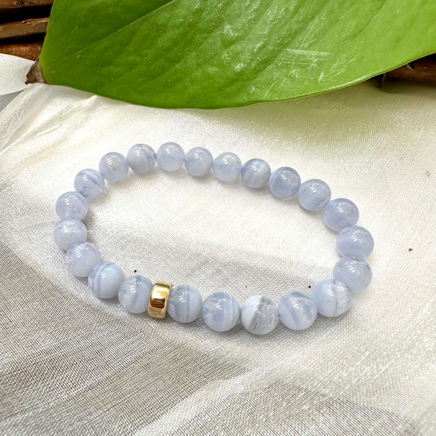 Blue Lace Agate Bracelet displayed on white cloth – gemstone bead close-up