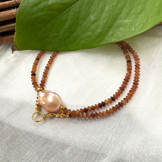 Hessonite garnet baroque pearl necklace featuring golden-pink baroque pearl and warm honey-orange hessonite.