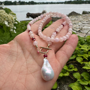 beautiful gemstones toggle necklace combining Soft pink morganite beads with tiny red Ruby rondelles separated with gold filled beads and finished with baroque pearl pendant. 18"inches long