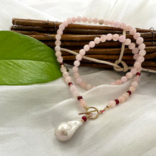 Load image into Gallery viewer, beautiful gemstones toggle necklace combining Soft pink morganite beads with tiny red Ruby rondelles separated with gold filled beads and finished with baroque pearl pendant. 18&quot;inches long
