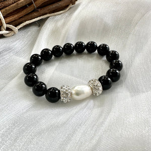 Black Onyx Chunky Bracelet with freshwater pearl in the middle adorned with 2 white polymer clay rhinestones, 10mm beads