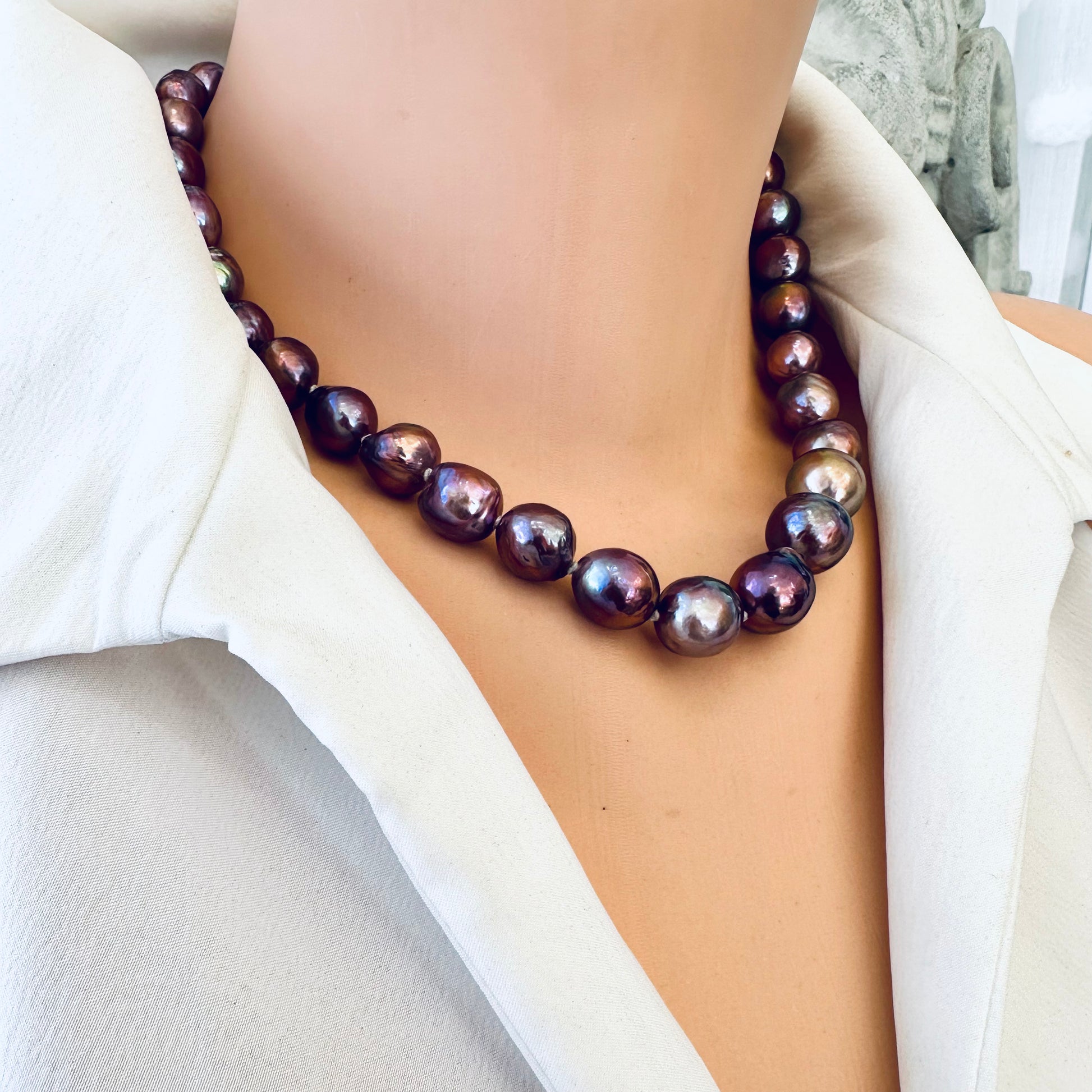 Purple Edison baroque pearl necklace displayed on mannequin in side view