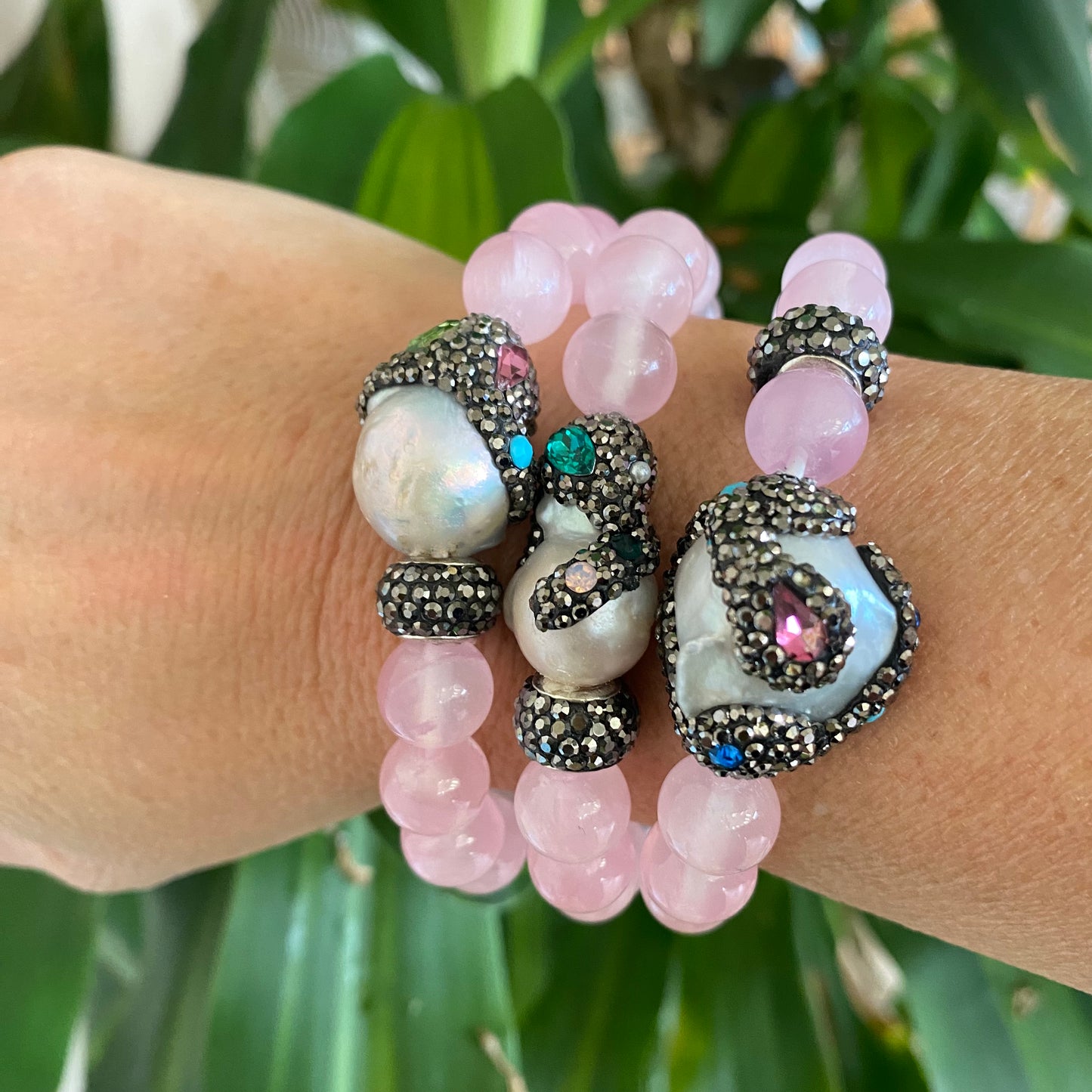 Jade pearl bracelets stacked on wrist