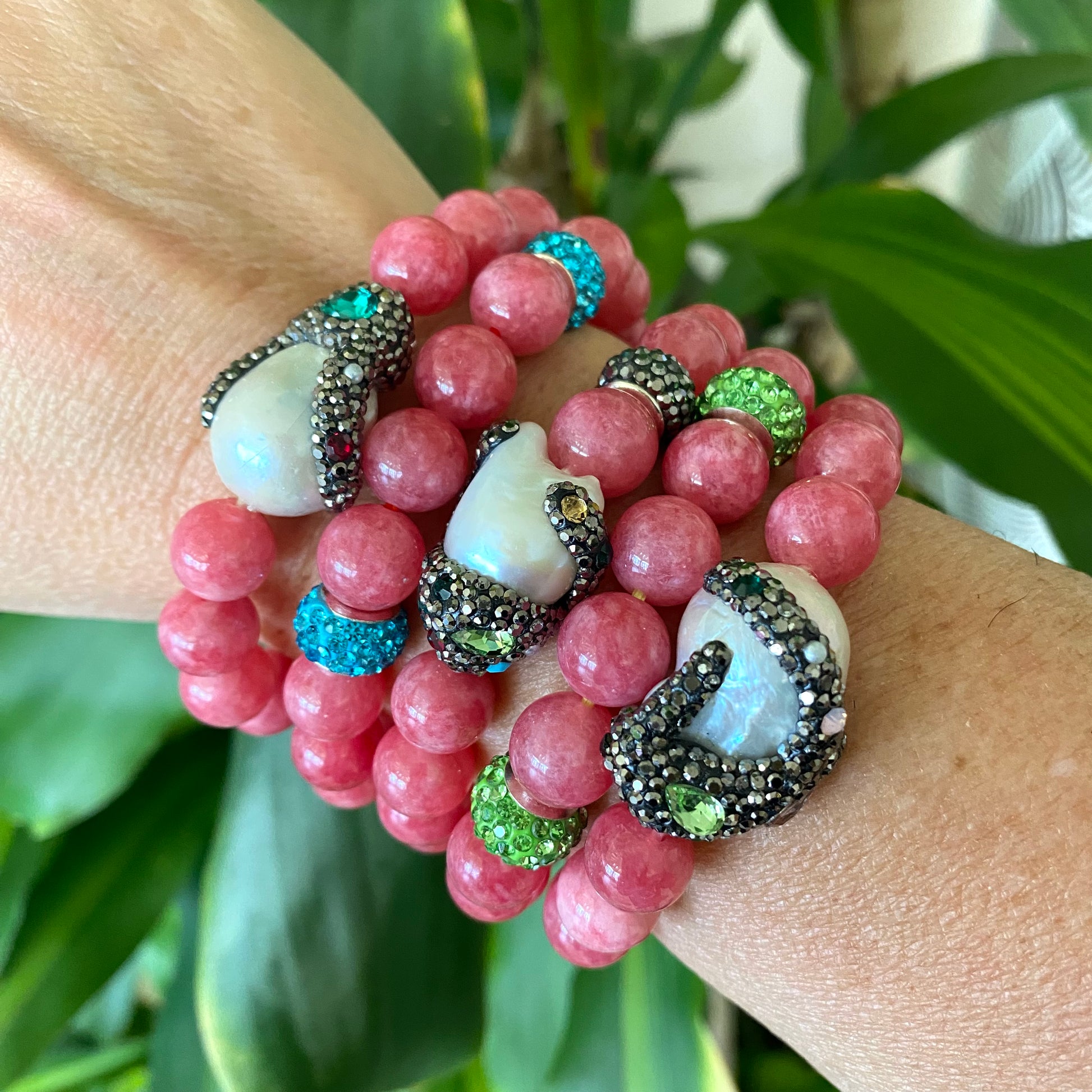 Jade pearl bracelets stacked on wrist