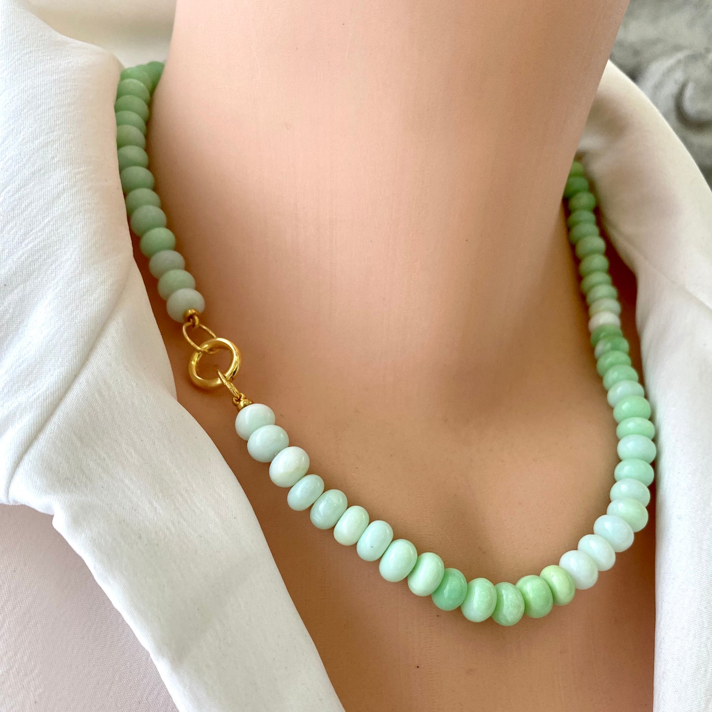 Green opal beaded necklace on mannequin showing bead detail