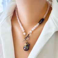 Rose quartz toggle necklace with black baroque pearl, featuring blush-pink beads and a unique floral charm.