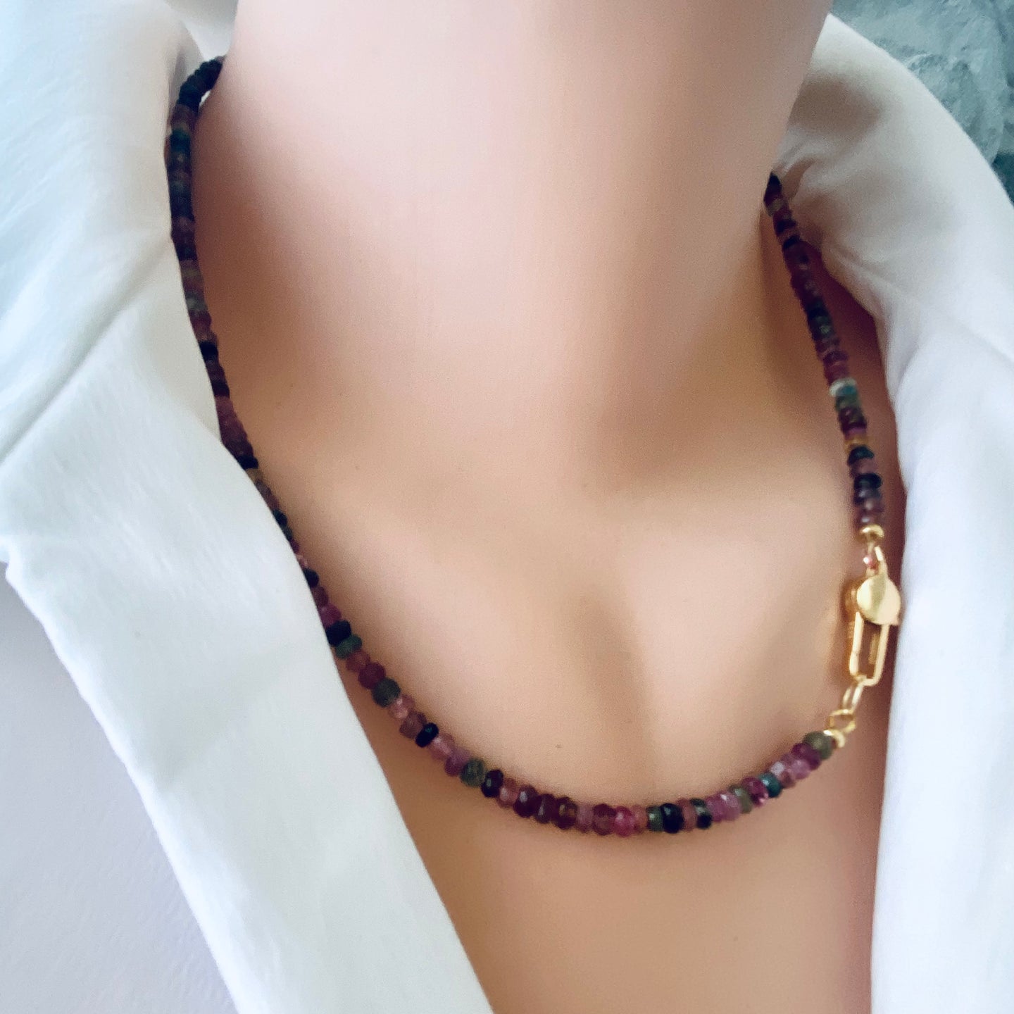 Mixed faceted tourmaline beaded necklace featuring a variety of watermelon multi-color tourmaline beads, accented with gold vermeil plated silver. The necklace is 19 inches long and showcases the vibrant colors associated with the October birthstone.