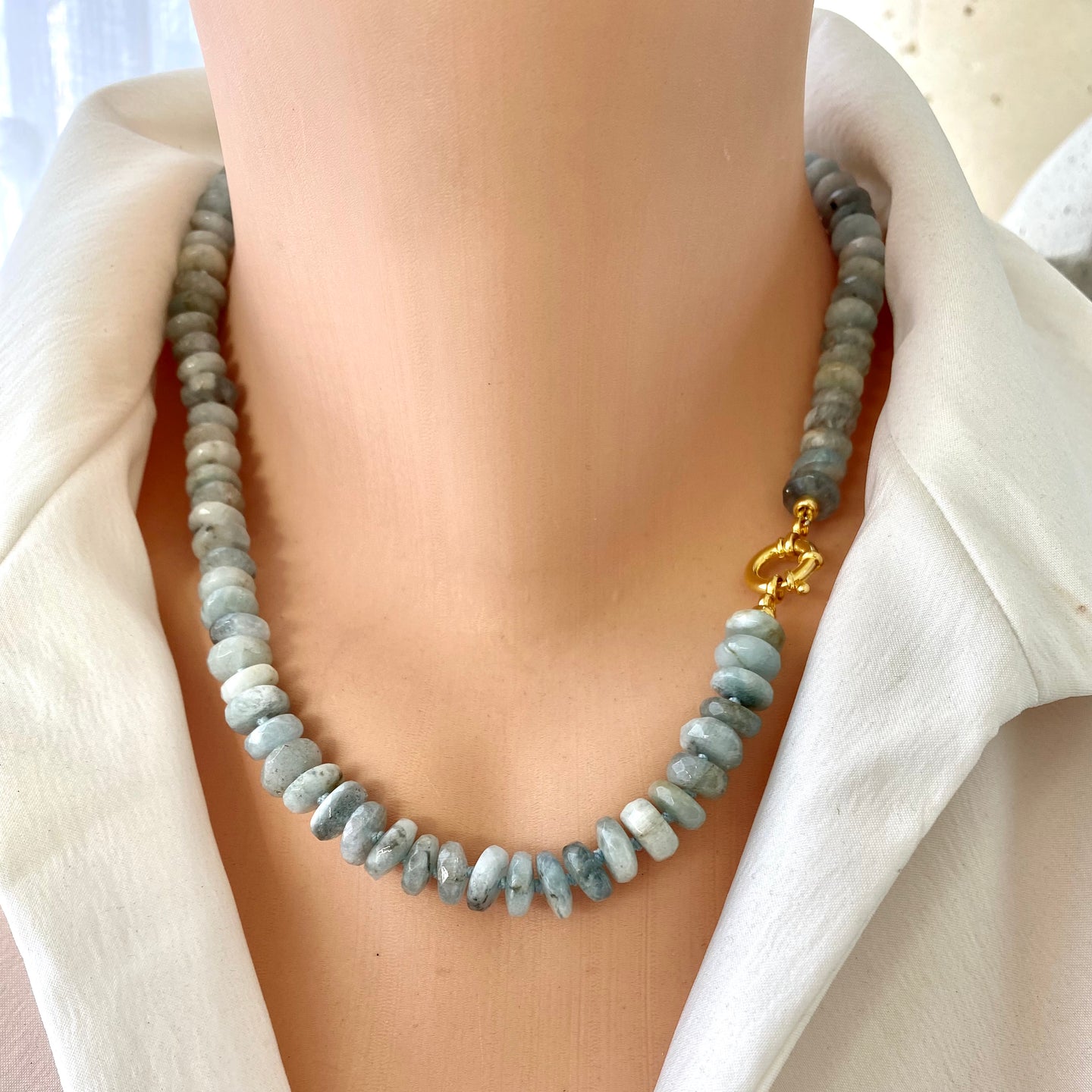 Hand-knotted candy necklace featuring faceted aquamarine rondelle beads with a gold vermeil plated silver marine closure. Available in 18.5 or 21.5 inches, this elegant piece is a perfect March birthstone gift for her.