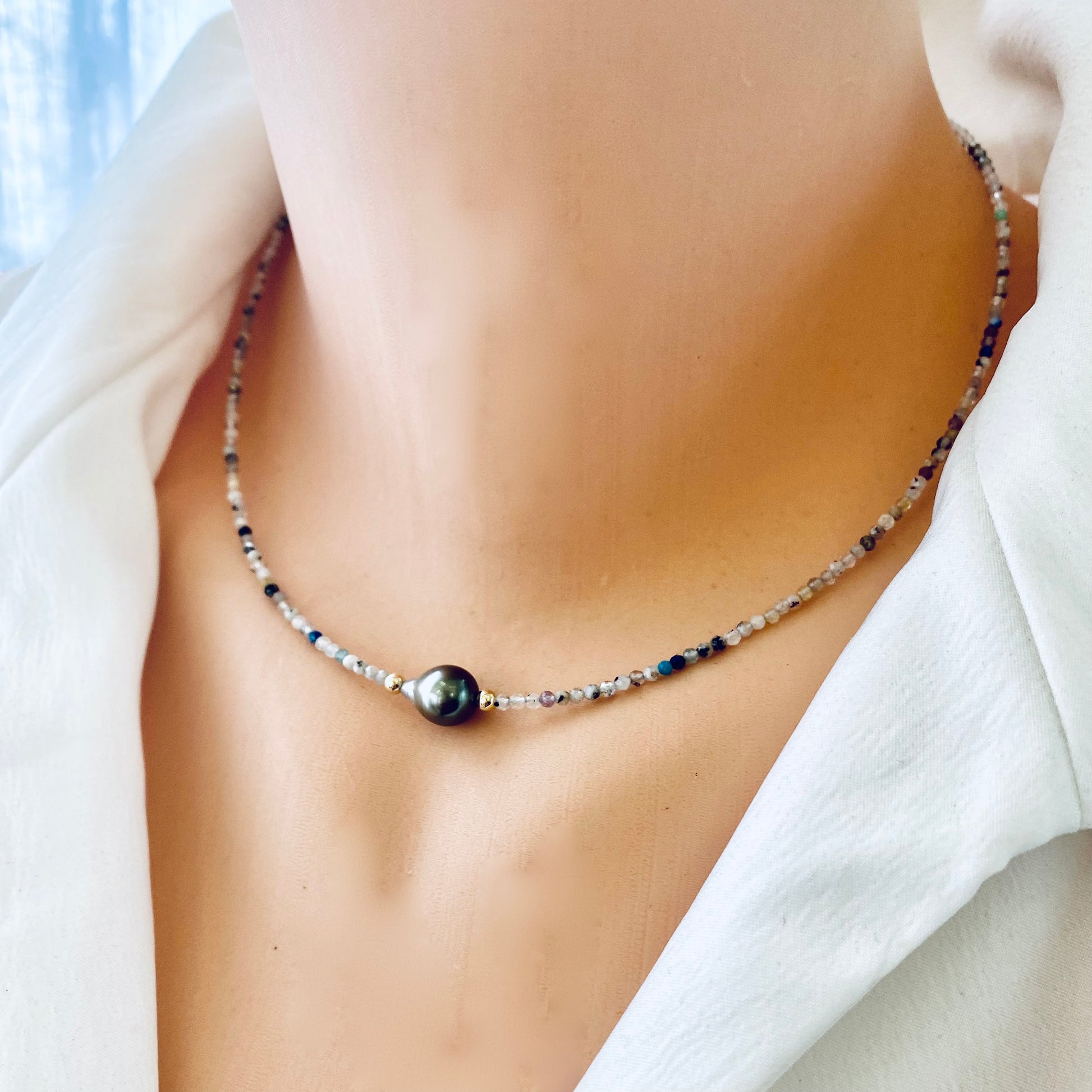 Multi stone pearl necklace worn on mannequin, front close-up