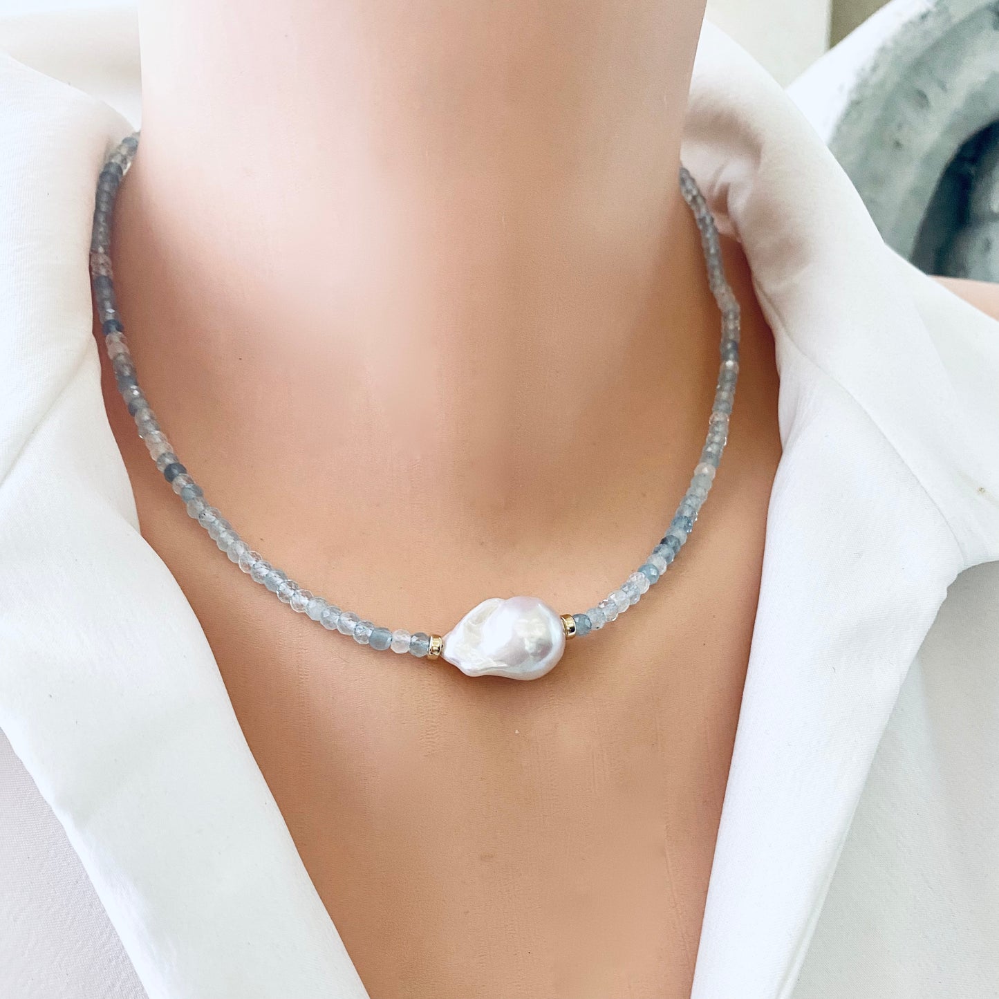 Aquamarine pearl necklace on mannequin showing baroque pearl detail