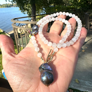 White moonstone bead necklace with 6mm beads, featuring a side black peacock pearl and a baroque pearl pendant, accented with a gold bronze artisan toggle and gold-filled details. This 18-inch necklace is an elegant June birthstone gift for her.