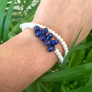 double wrap bracelet, featuring two strands of shimmering freshwater pearls beautifully accented with deep blue Lapis Lazuli teardrop briolettes, Gold filled details.