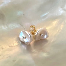 Load image into Gallery viewer, White Keshi pearl stud earrings with a petal shape and a tiny pearl in the center, resembling flowers, set in gold vermeil-plated silver.
