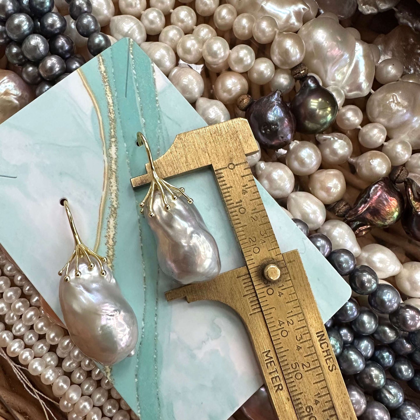 Gold vermeil silver grey baroque pearl drop earring pearl measured for size, showing irregular natural baroque form.