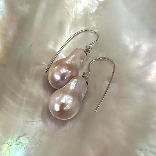Lavender Baroque Pearl Earrings – silver design displayed on white pearl shell