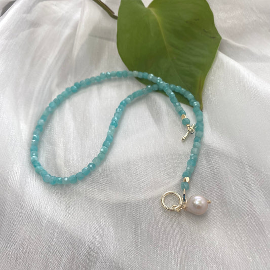 Blue amazonite baroque pearl necklace showcasing soft aqua-blue gemstones and a pearl charm.