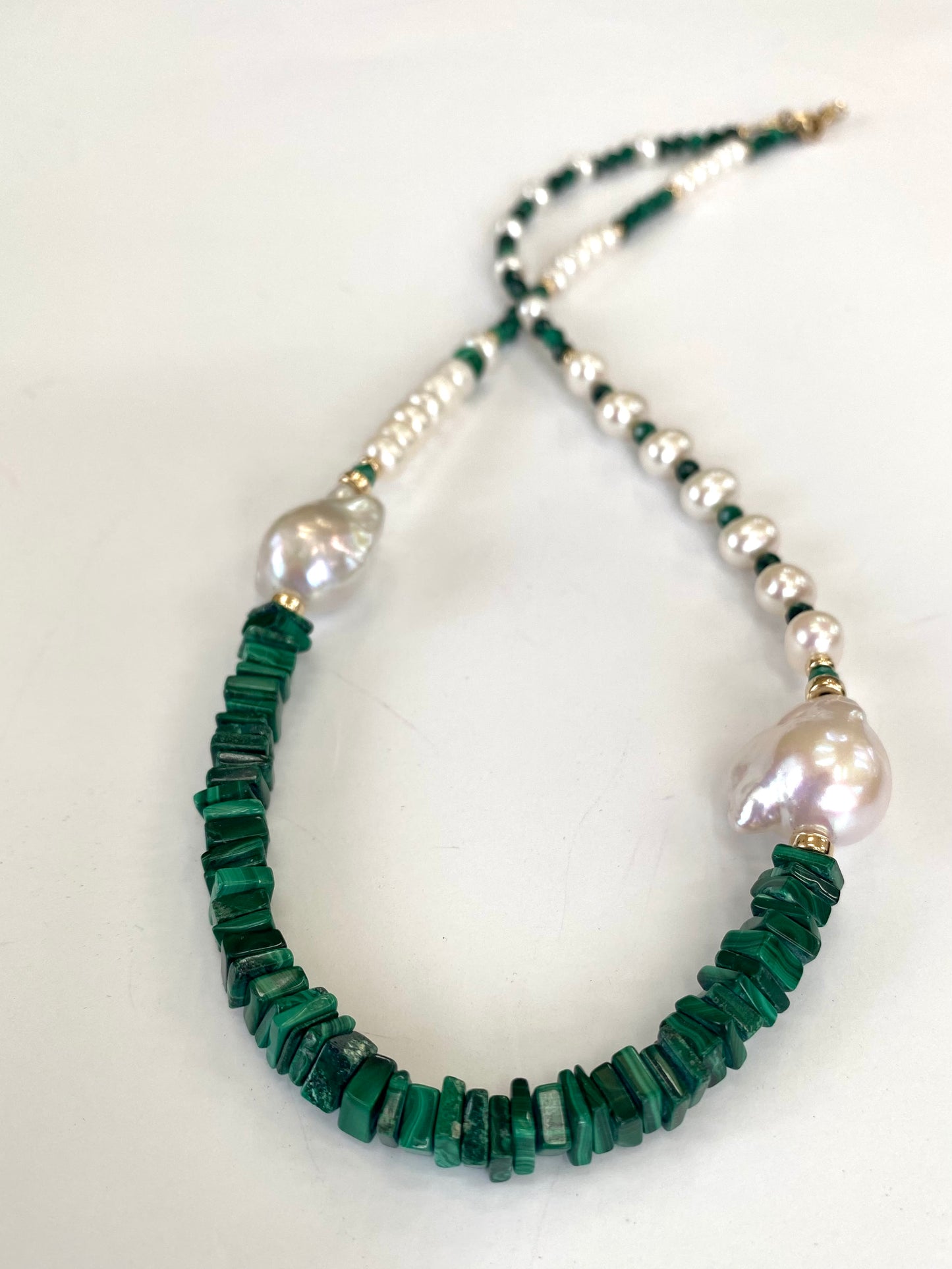 Malachite baroque pearl necklace in 14K gold filled featuring smooth green malachite and luminous baroque pearls.