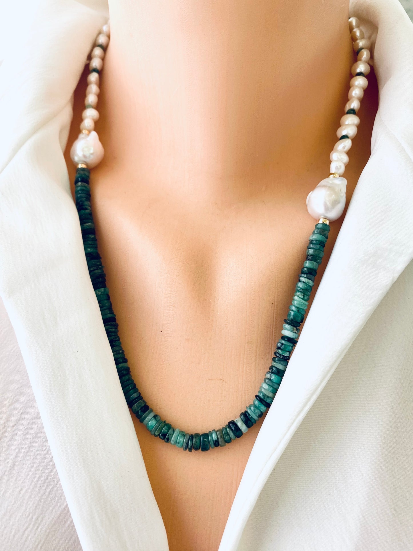 Emerald baroque pearl necklace featuring asymmetric design with Emerald disk beads and luminous Baroque pearls.