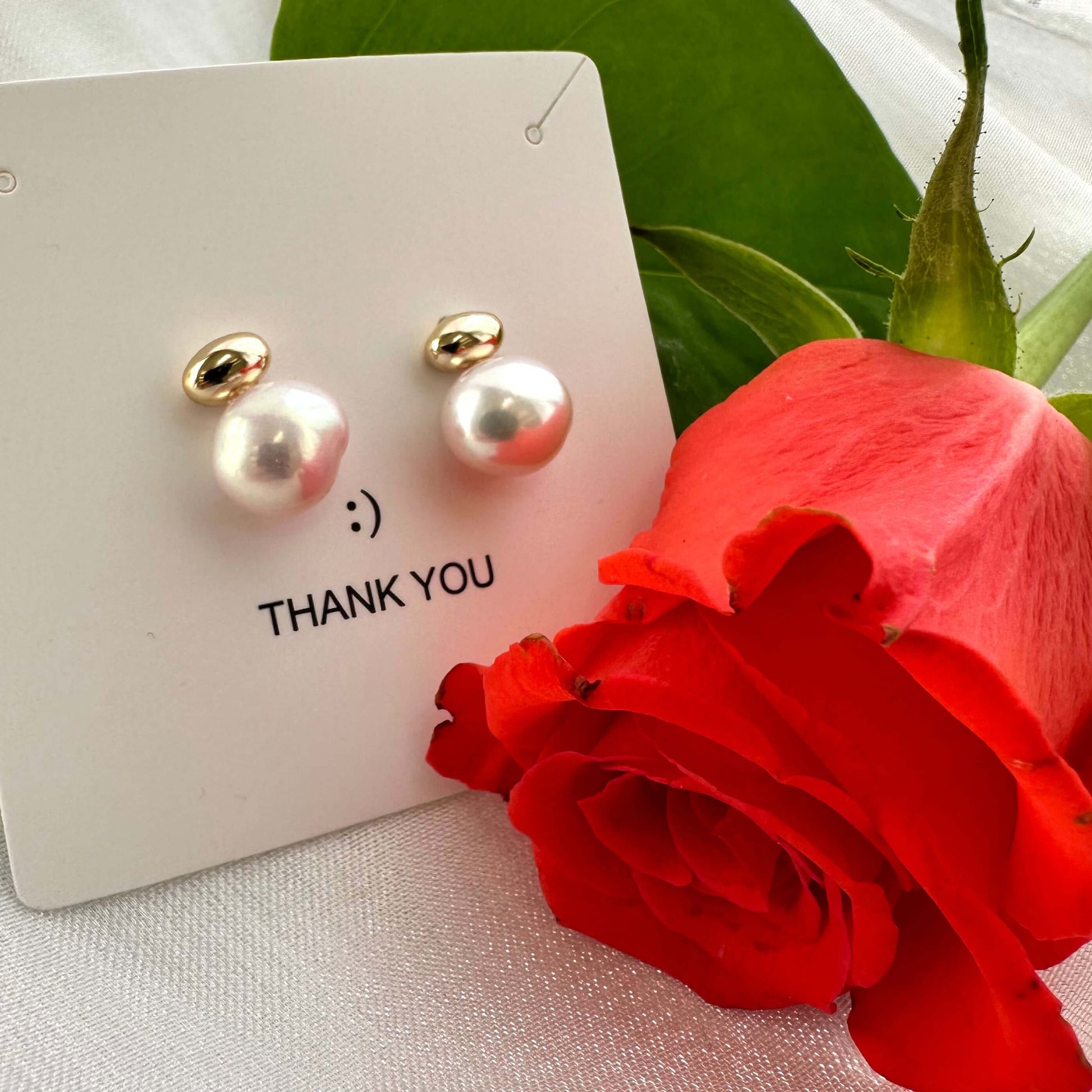 Nugget pearl stud earrings in gift box beside red rose, handmade in Canada