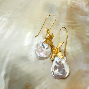 Large Petal pearls dangling gracefully from gold vermeil-plated silver fish hook settings in the shape of flowers, 50mm