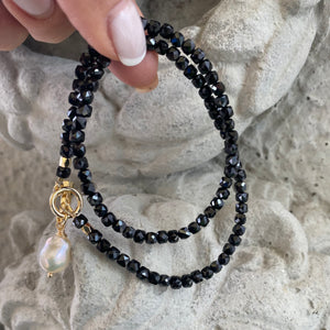 Black Tourmaline faceted cube beadsToggle choker Necklace holding a small Baroque Pearl Pendant to add an elegant touch to the piece. Gold plated details. Measuring 16 inches