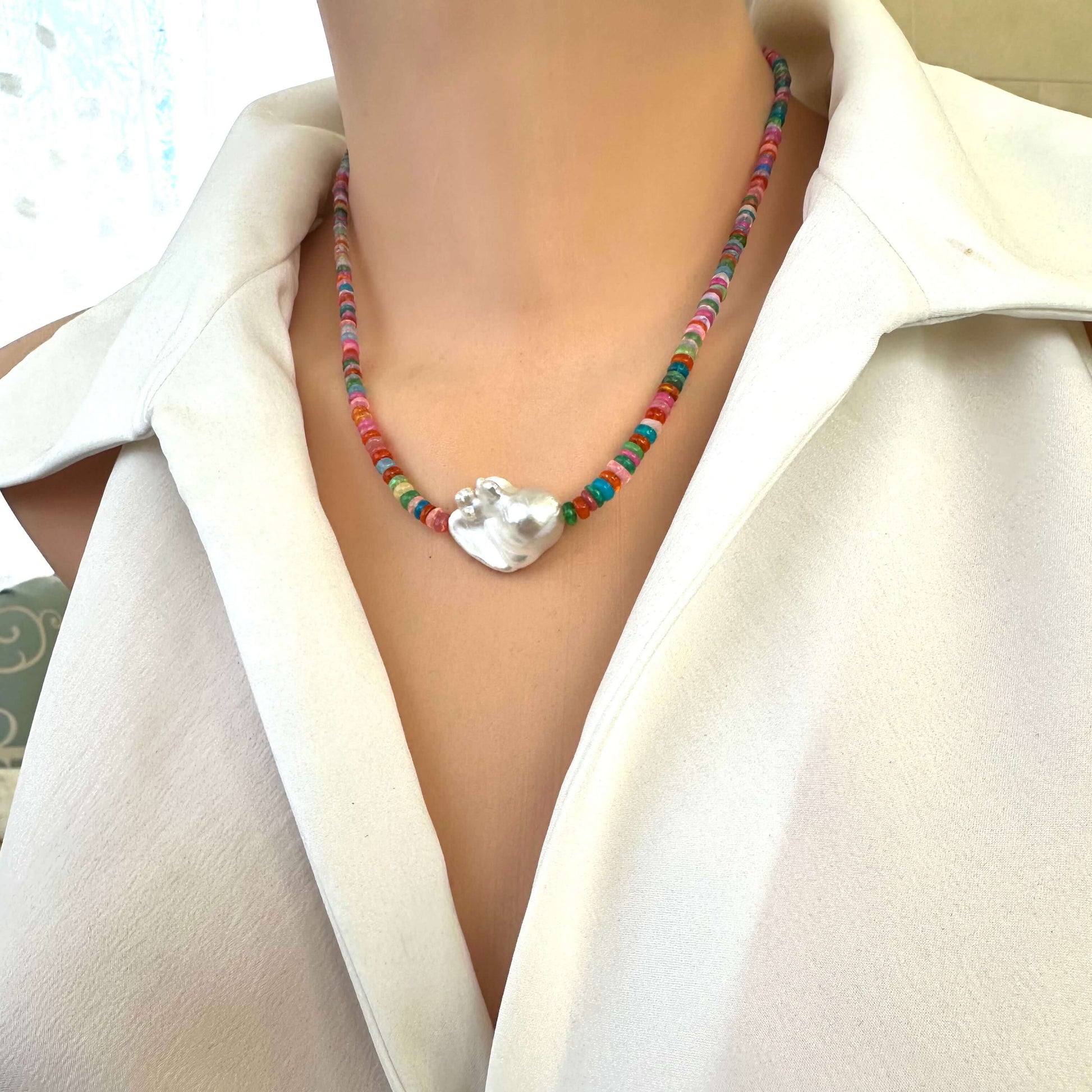Angled view of opal and baroque pearl necklace, handmade Ethiopian opals