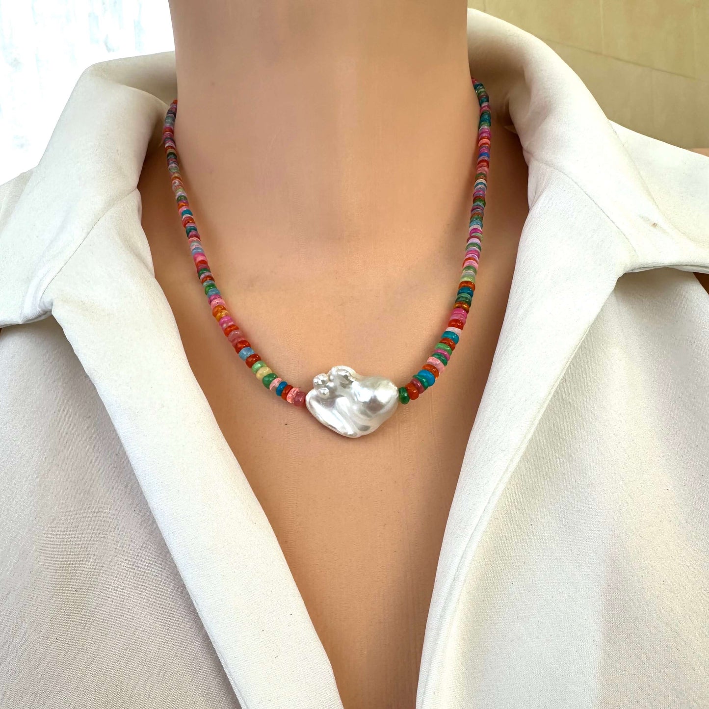 Detailed front view of opal and baroque pearl necklace showing multicolor opals