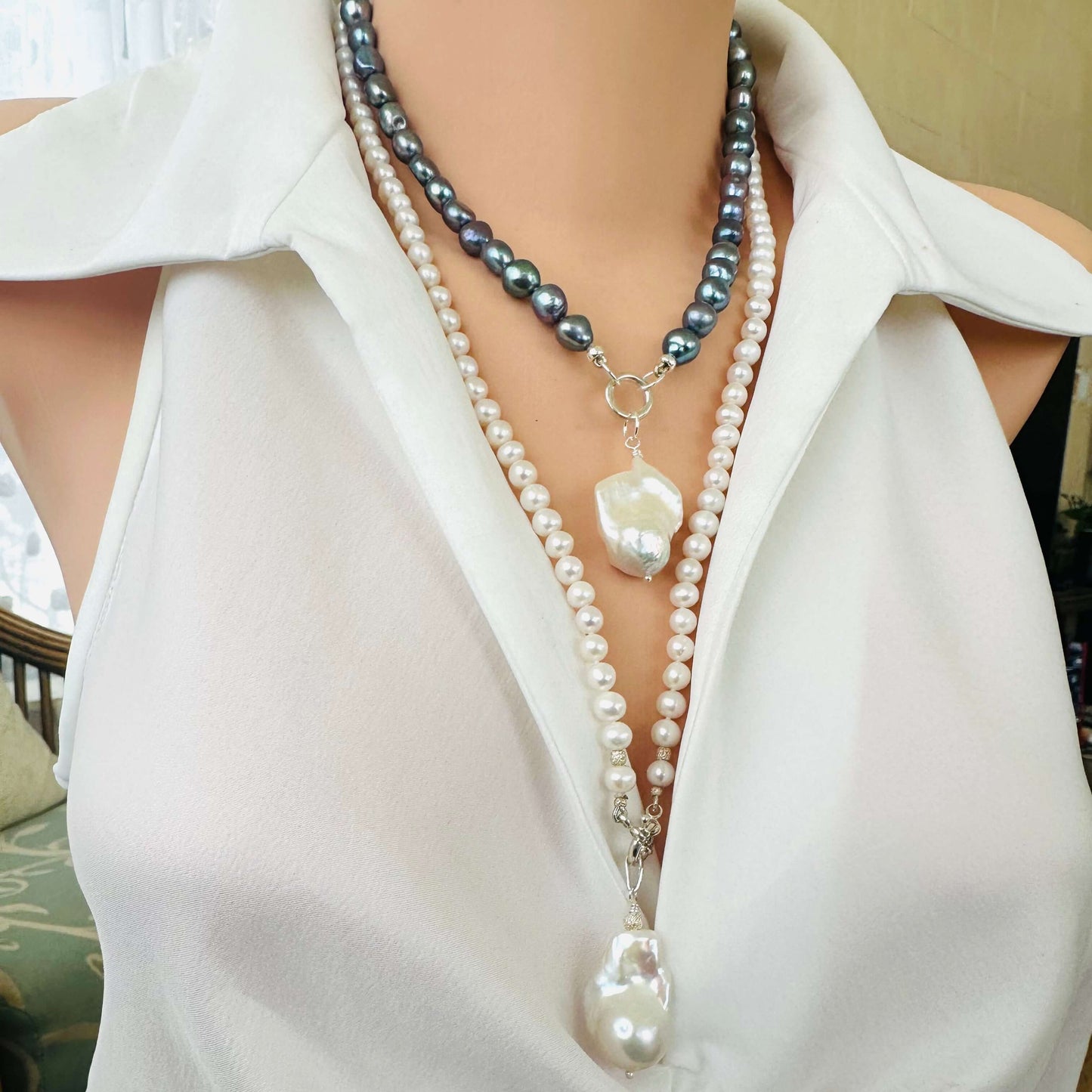 Black pearl necklace with baroque pendant shown on mannequin, elegant design