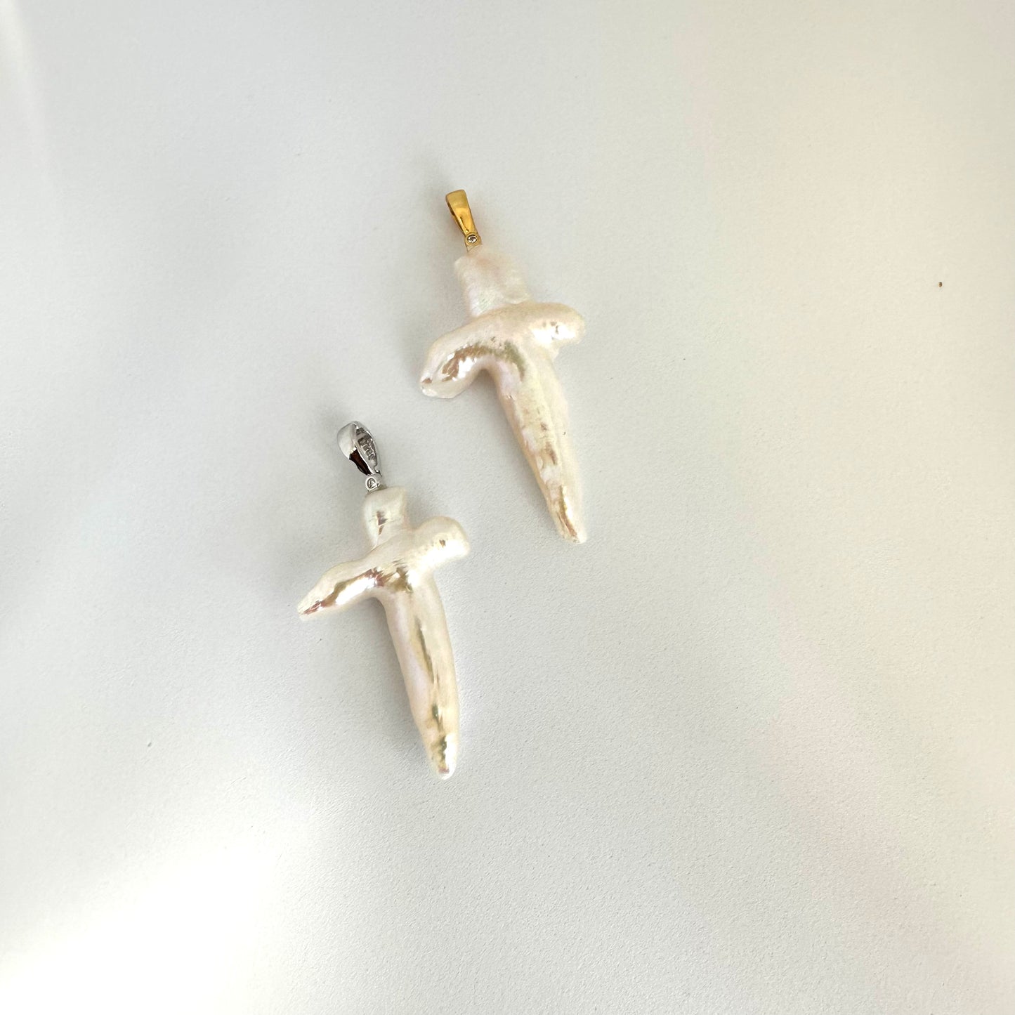 White pearl necklace cross pendant close-up showing gold vermeil and rhodium silver cross options — handcrafted jewelry by Loulia Pearl Jewelry