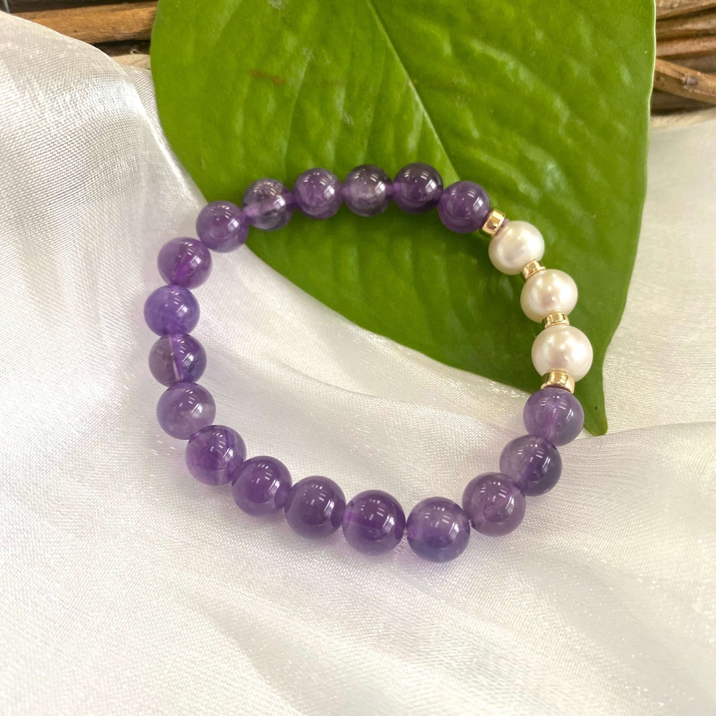 Amethyst Pearl Bracelet close-up on white cloth – individual gold filled design
