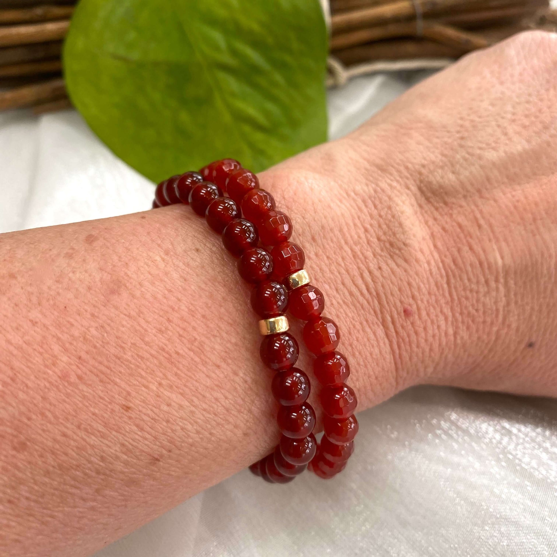 Red Agate Bracelet featuring 6mm beads paired with 14K Gold Filled accents worn on a wrist.