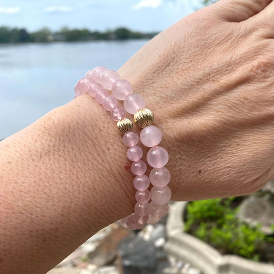 Rose Quartz Bracelet worn on woman’s wrist – stacked natural light shot