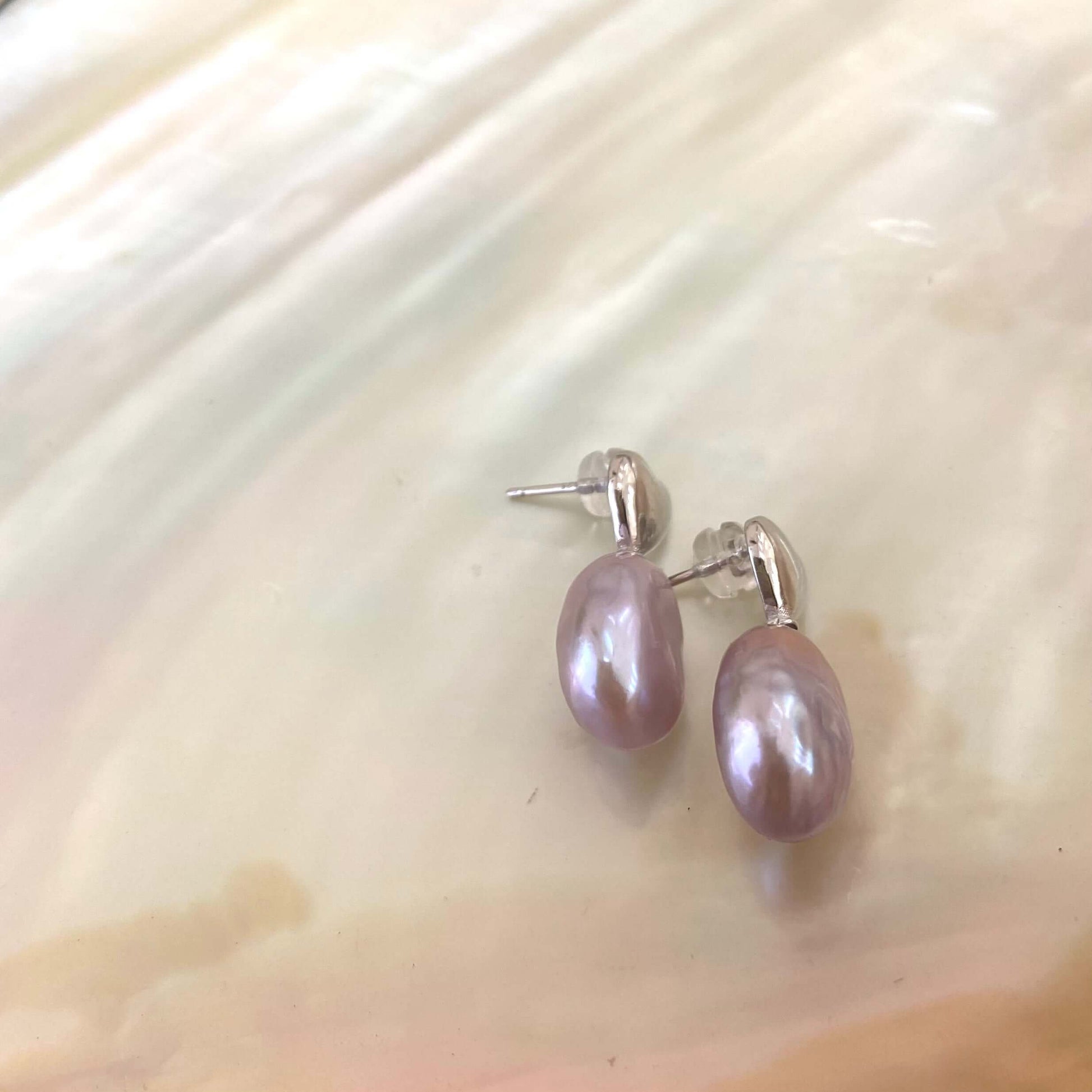 Heart Pearl Earrings – detailed silver pair displayed on white shell background
