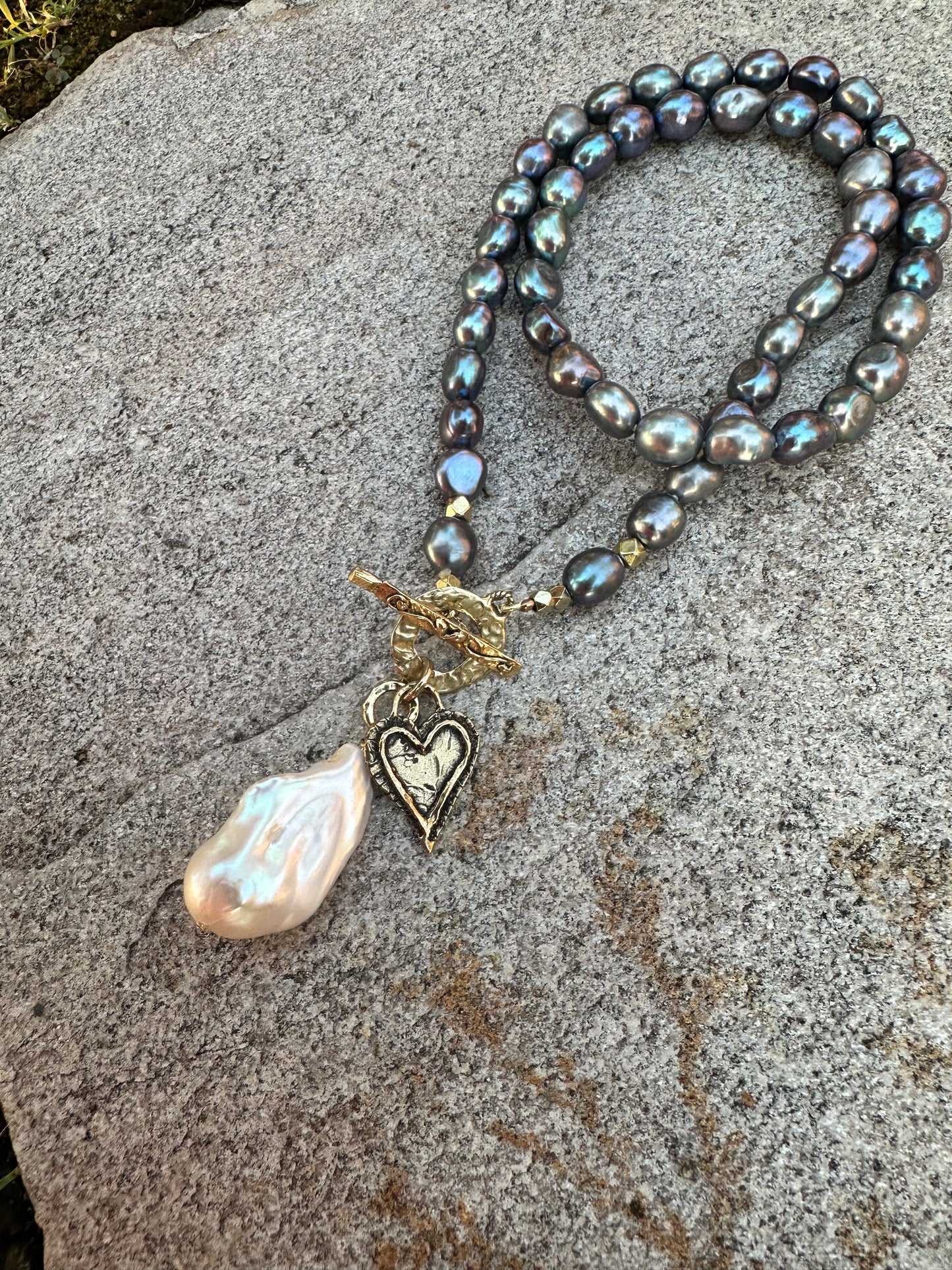 Black pearl baroque pearl necklace featuring artisan gold bronze toggle clasp and baroque pearl pendant