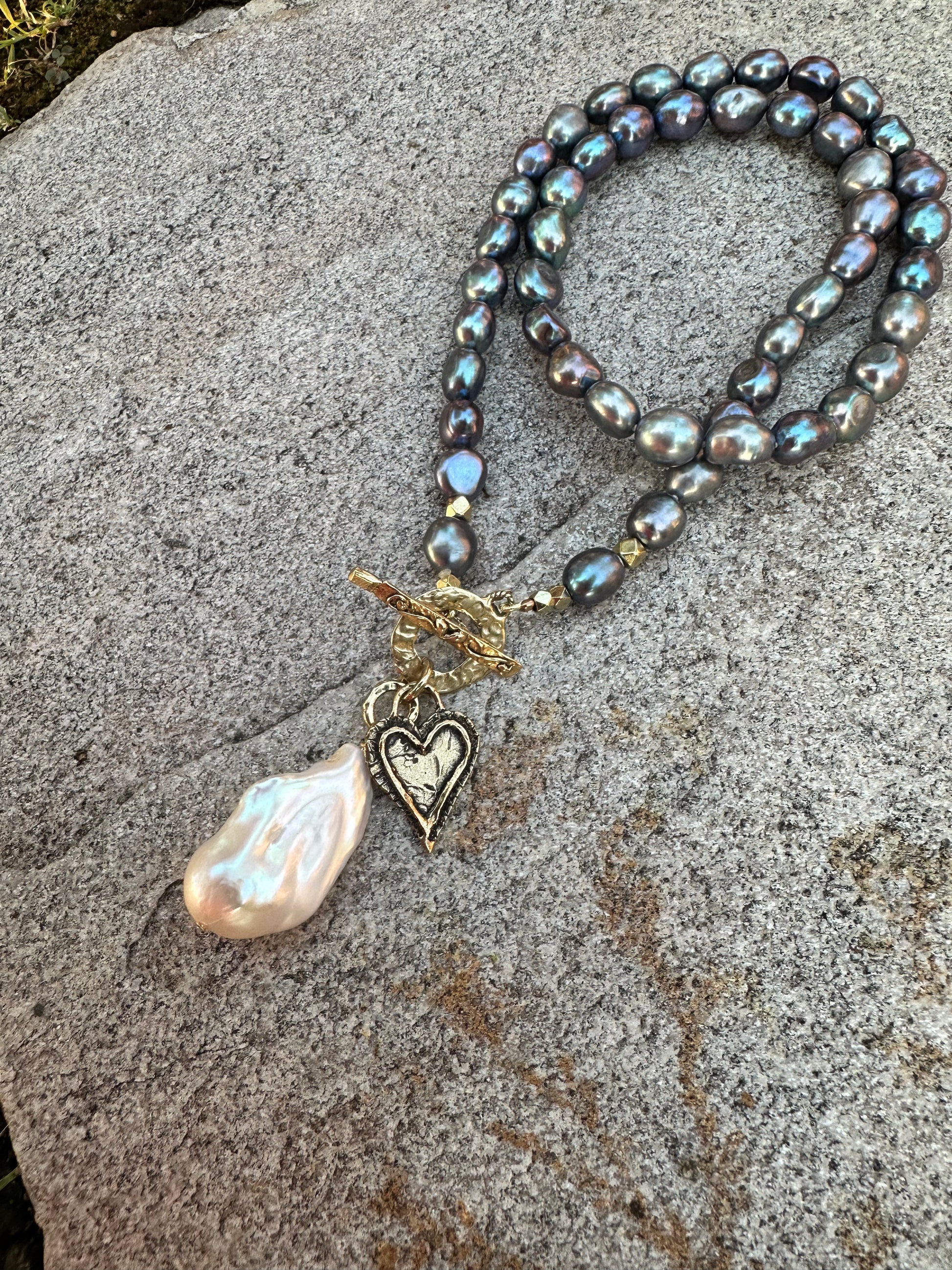 Black pearl baroque pearl necklace featuring artisan gold bronze toggle clasp and baroque pearl pendant