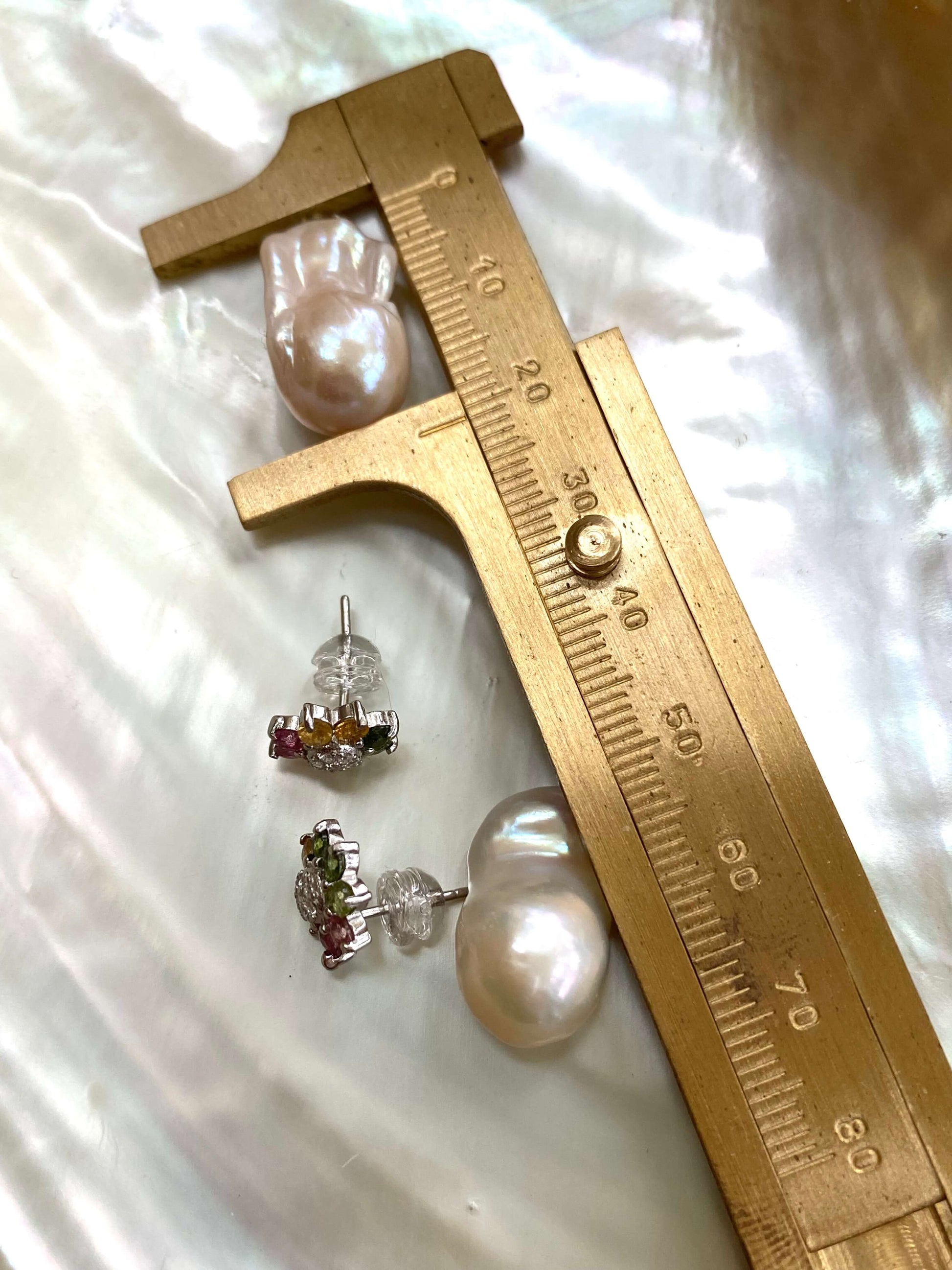 White baroque pearl drop measured by ruler from tourmaline pearl earrings set