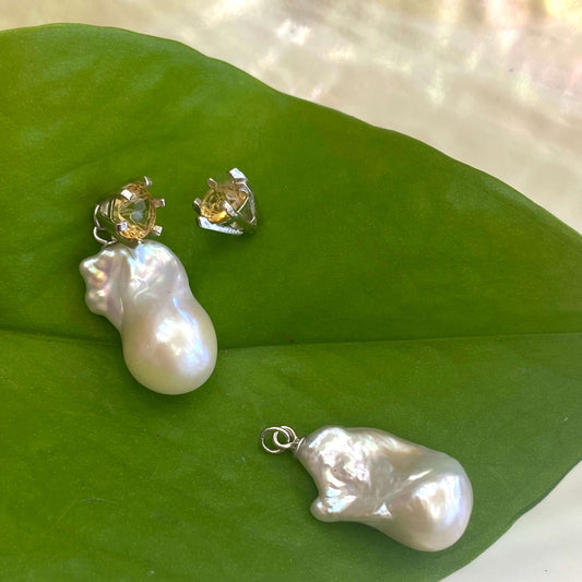 Citrine stud earrings with removable pearl drops, one stud shown detached