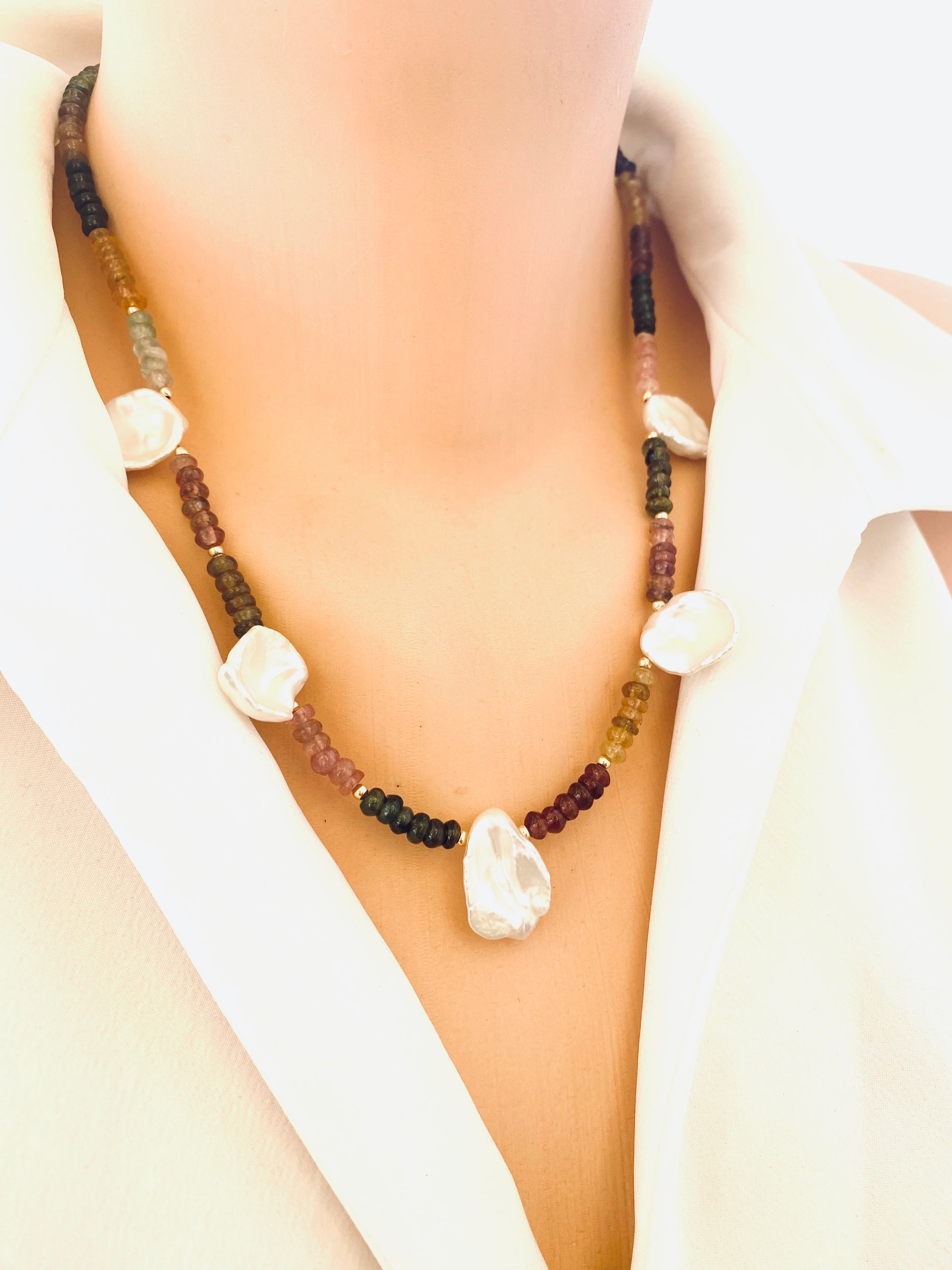 Multi tourmaline and keshi pearl necklace angled view on mannequin, natural handcrafted design.