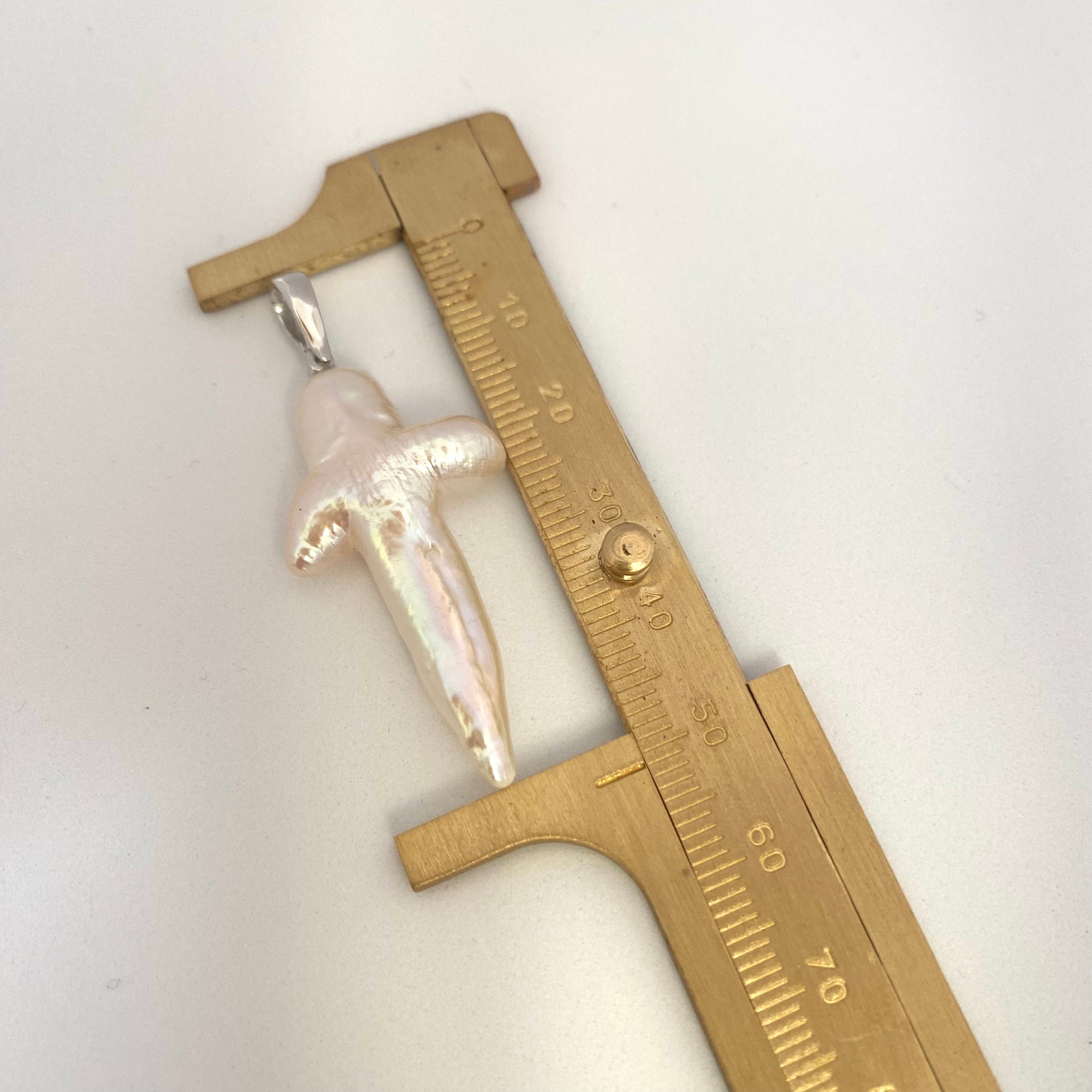 Labradorite aquamarine pendant necklace close-up showing pearl cross pendant measured against ruler — handcrafted gemstone jewelry by Loulia Pearl Jewelry