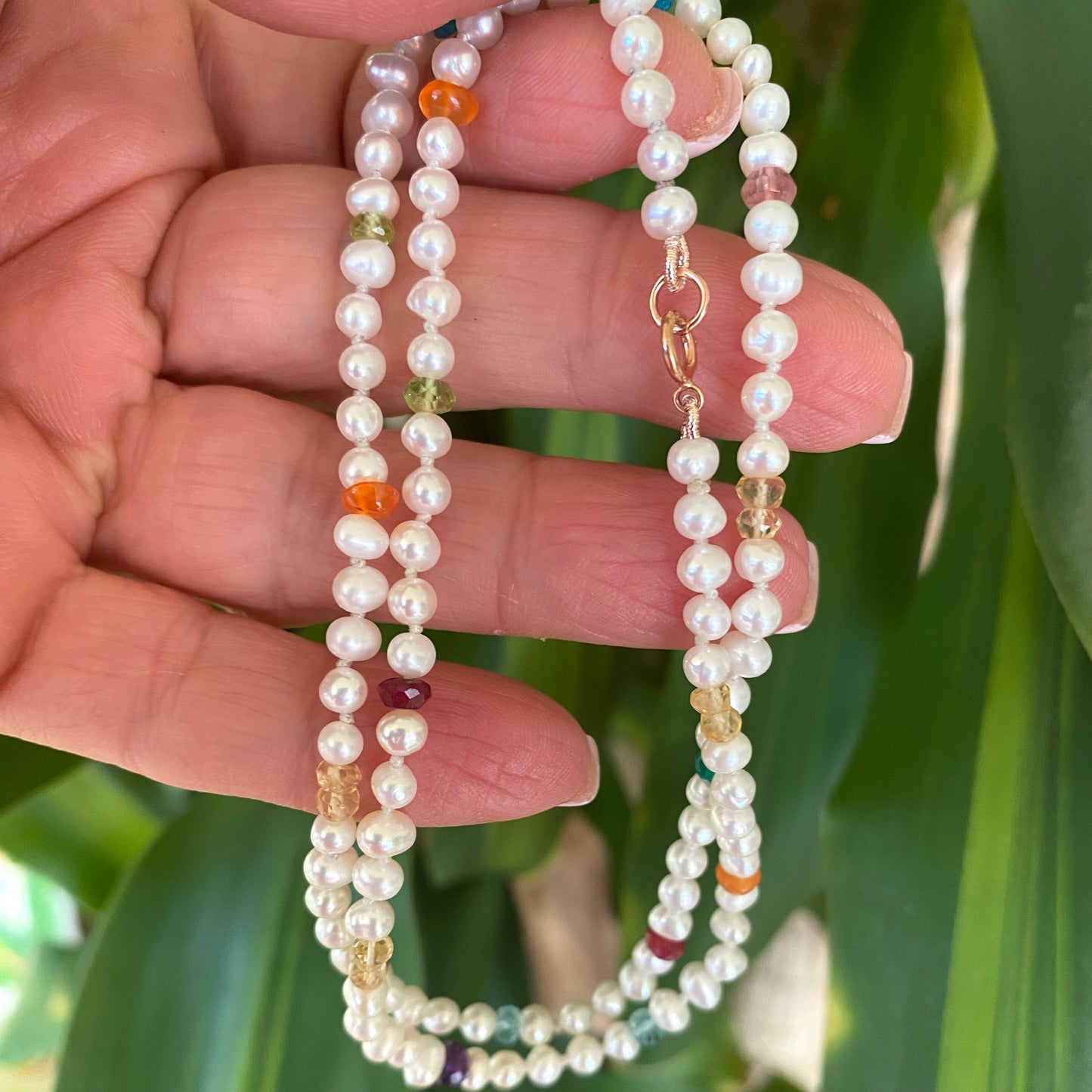 Rainbow gemstone pearl necklace featuring multi faceted gemstones and tiny pearls