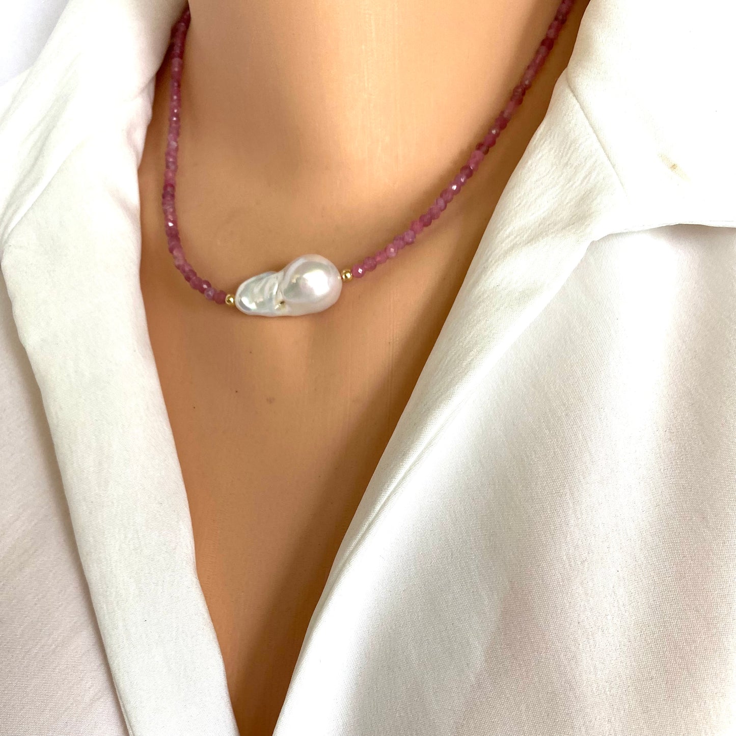 Pink Tourmaline Baroque Pearl Necklace on model, featuring pink tourmaline beads and a baroque pearl centerpiece.