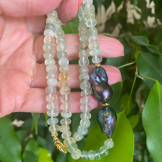 Prehnite and Black Baroque Pearl Necklace showcasing translucent greens and striking black pearls, handcrafted design.