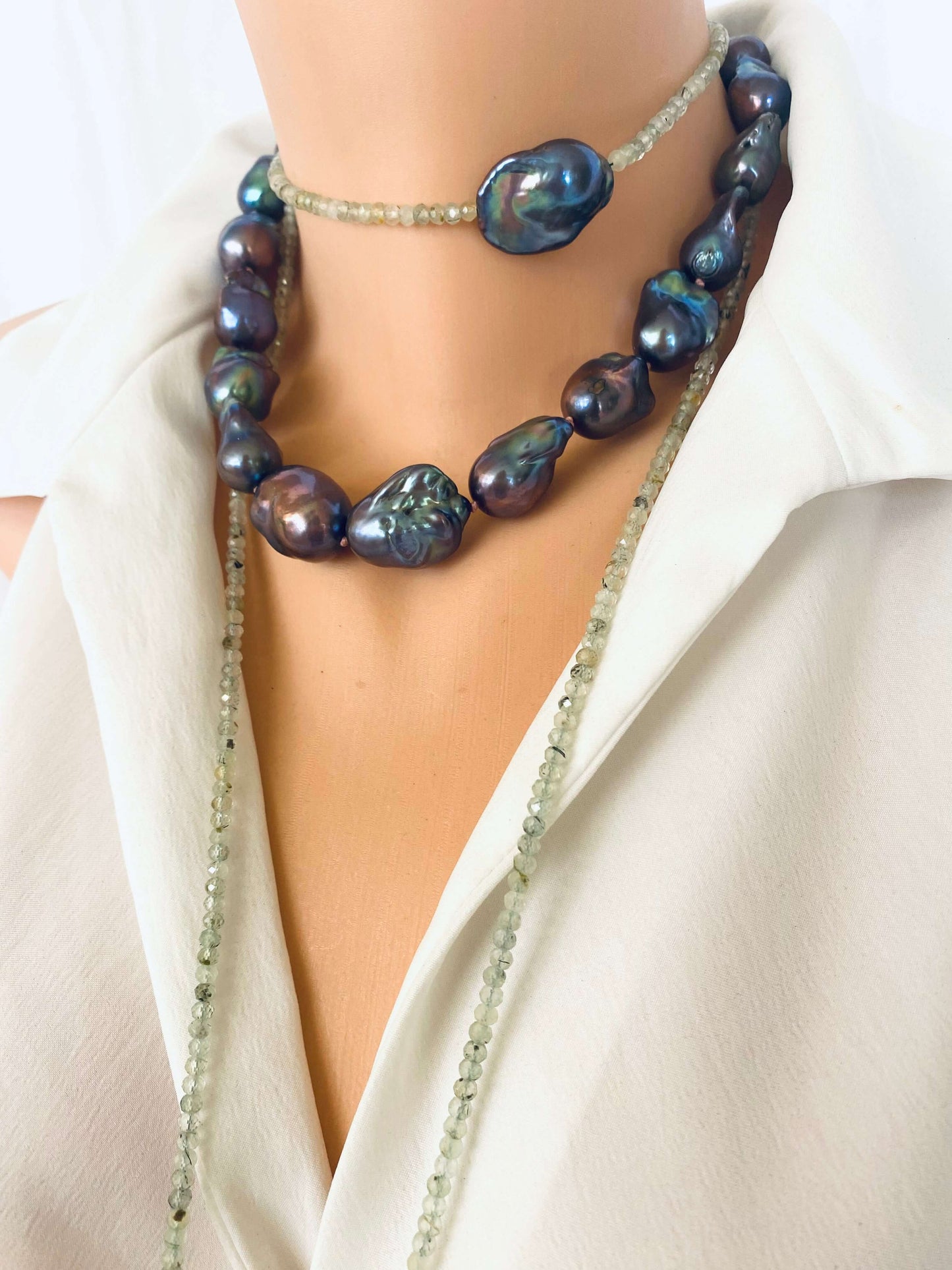 Green Prehnite and Black Baroque Pearls Lariat Necklace on a mannequin showcasing a blend of soft greens and lustrous blacks.