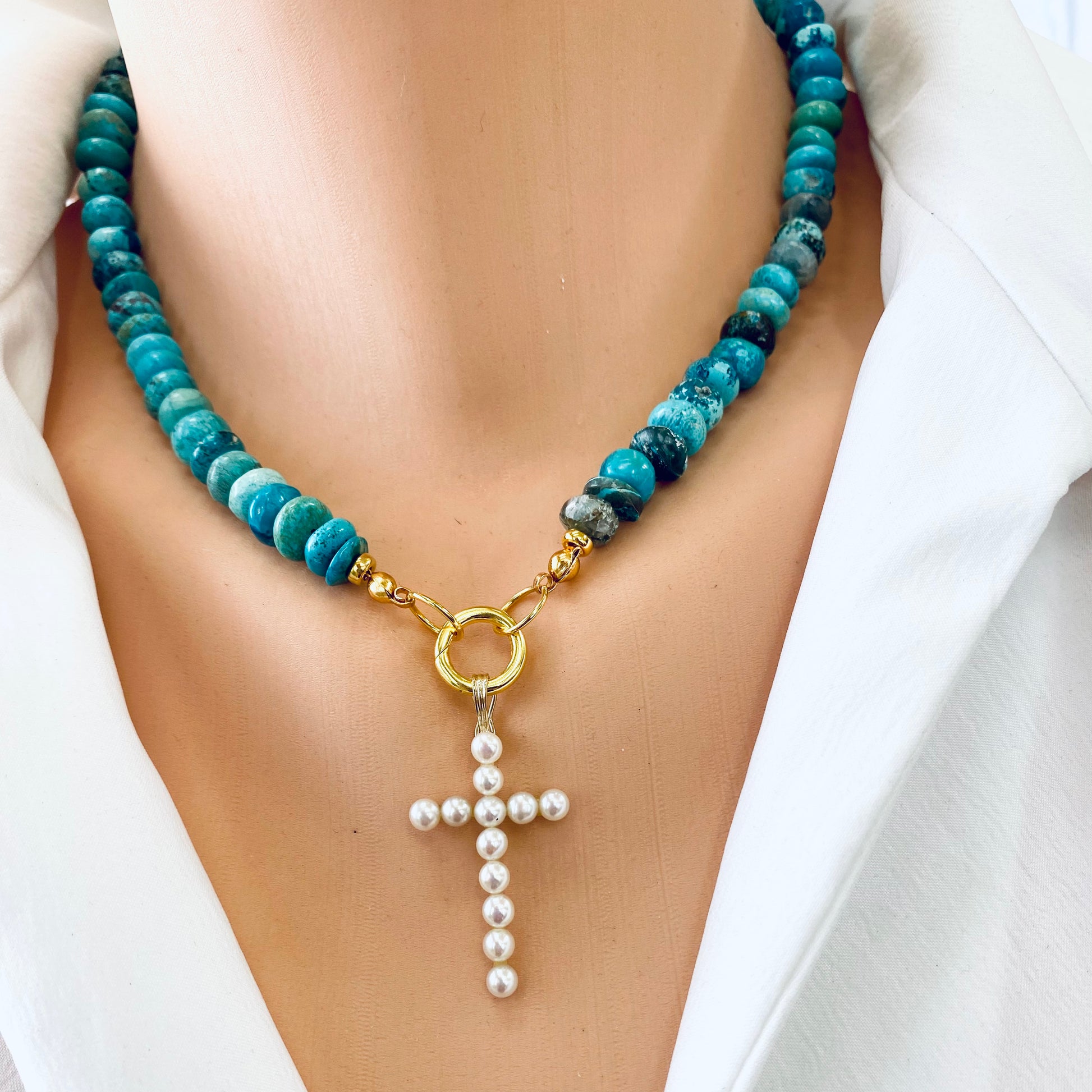 Turquoise candy necklace featuring Arizona turquoise beads and a gold cross pendant with pearls.