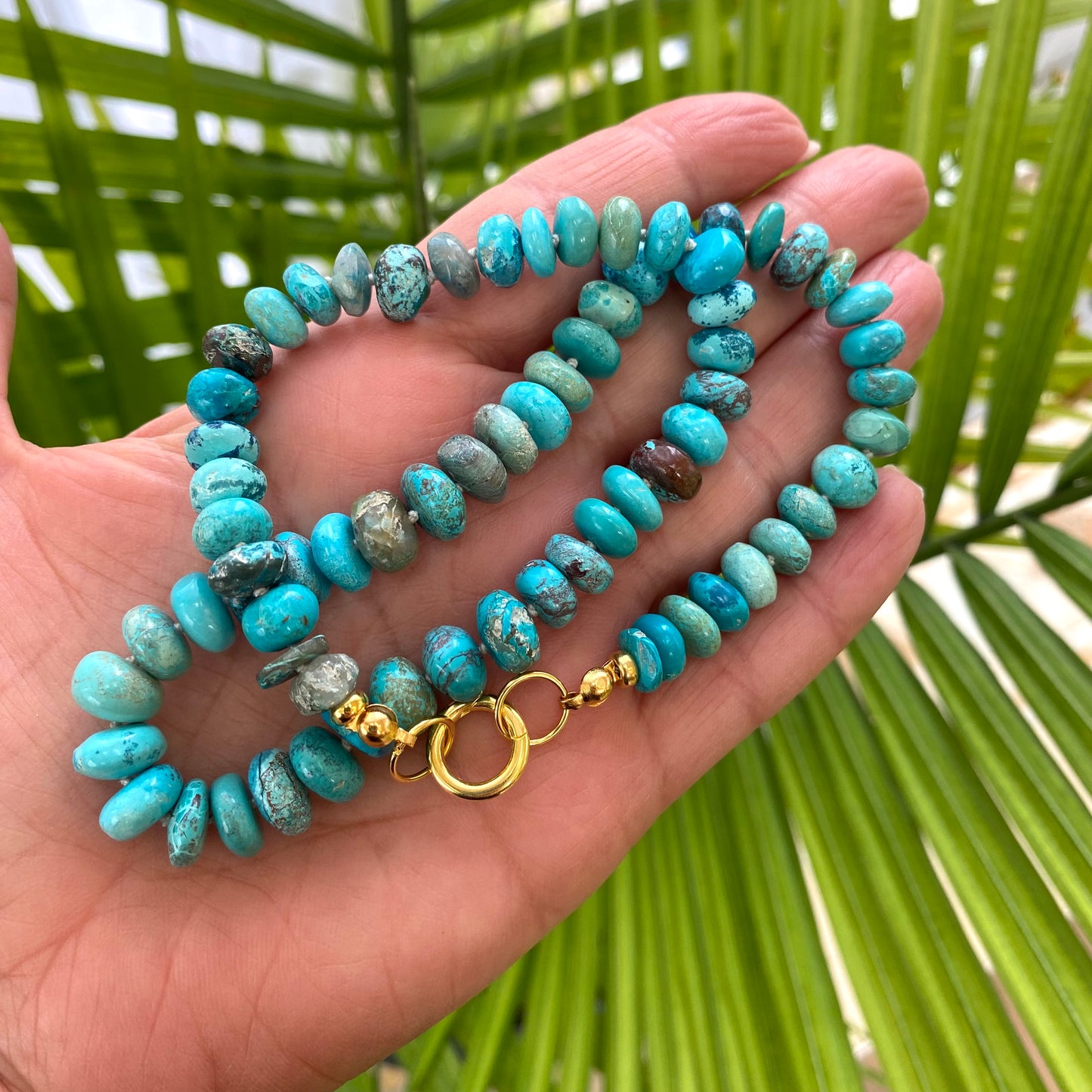 Turquoise candy necklace featuring Arizona turquoise rondelle beads in vibrant blue-green tones with a gold clasp.